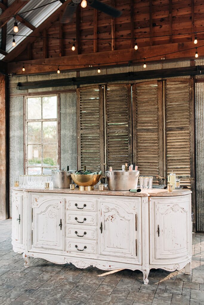 rustic bar at outdoor cocktail hour at The Barn at Shady Lane wedding