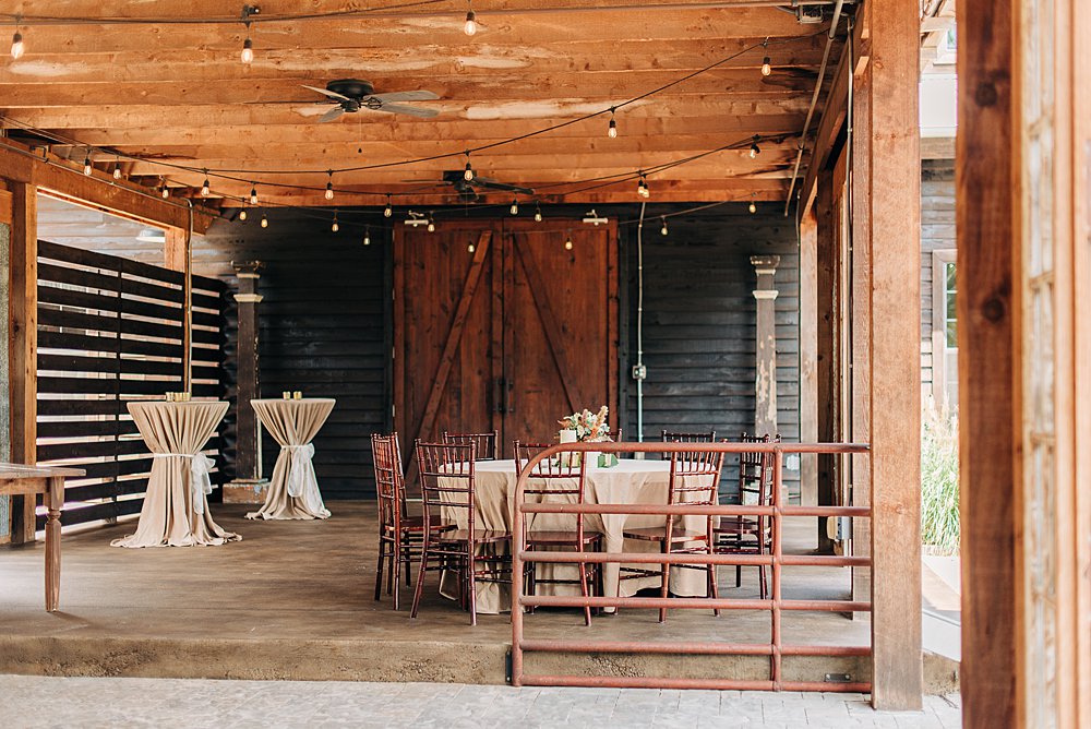 covered cocktail patio at The Barn At Shady Lane wedding venue
